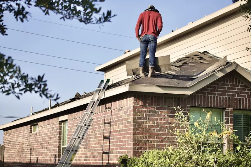 Professional roofer working on a residential roof in View